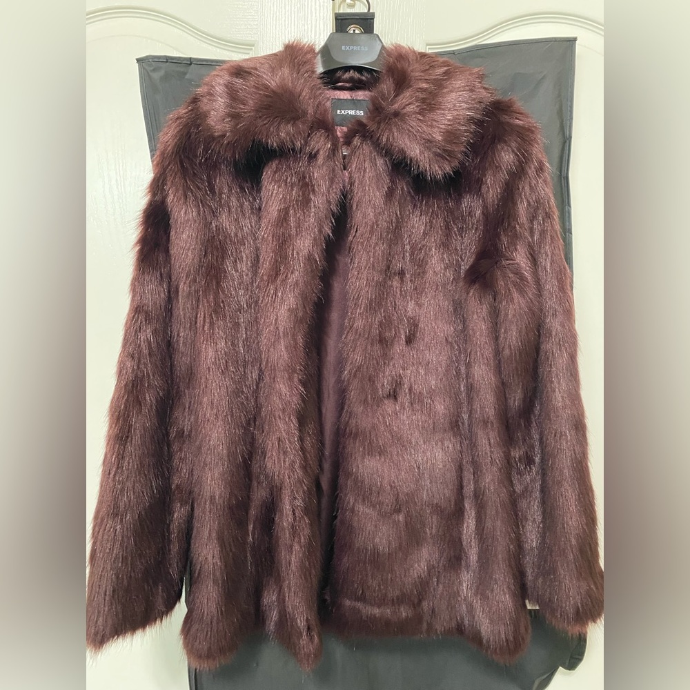 Express never worn dark plum color faux fur jacket. Has pockets